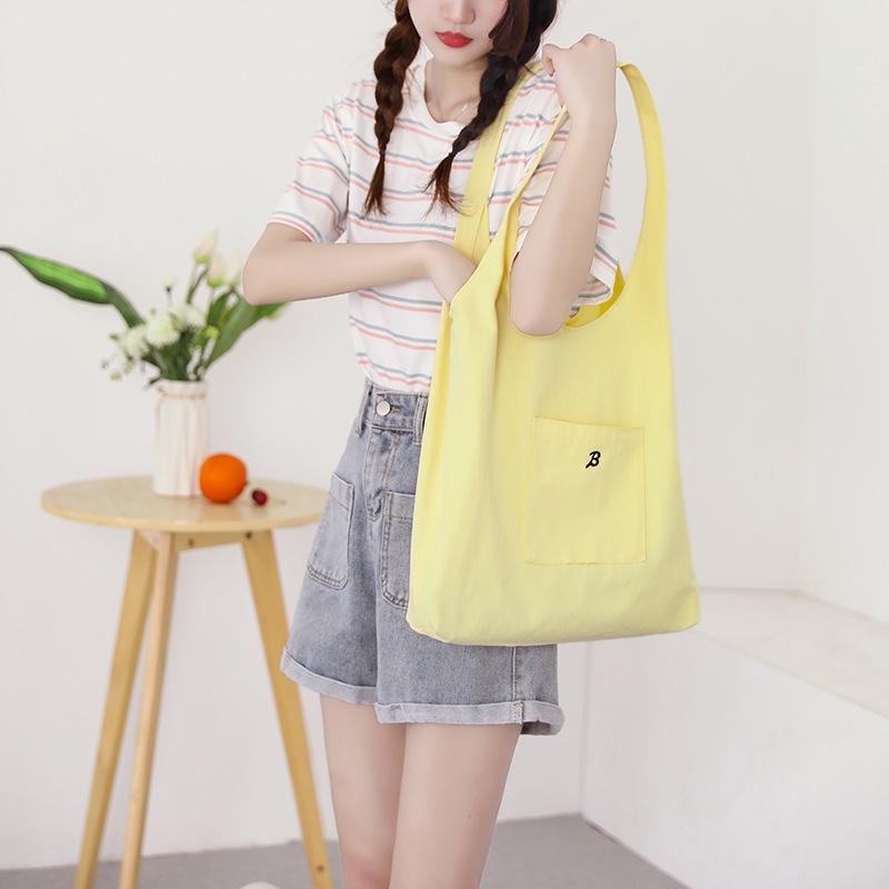 Túi đeo vai vải canvas màu vàng nhạt