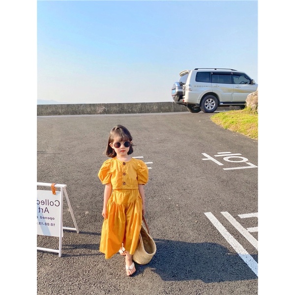 Váy bé gái phong cách Âu màu vàng