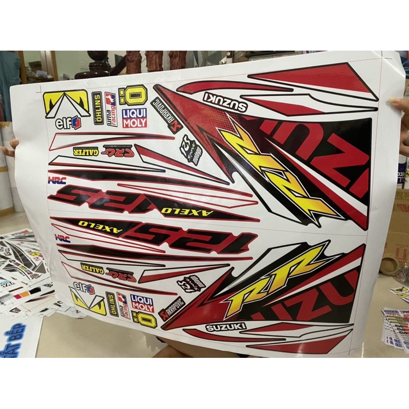 ( Quí khách vui lòng mang ra tiệm cho thợ dán ) Tem Axelo đỏ đen