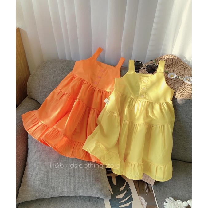 Váy vàng cam xoè tầng cho bé gái