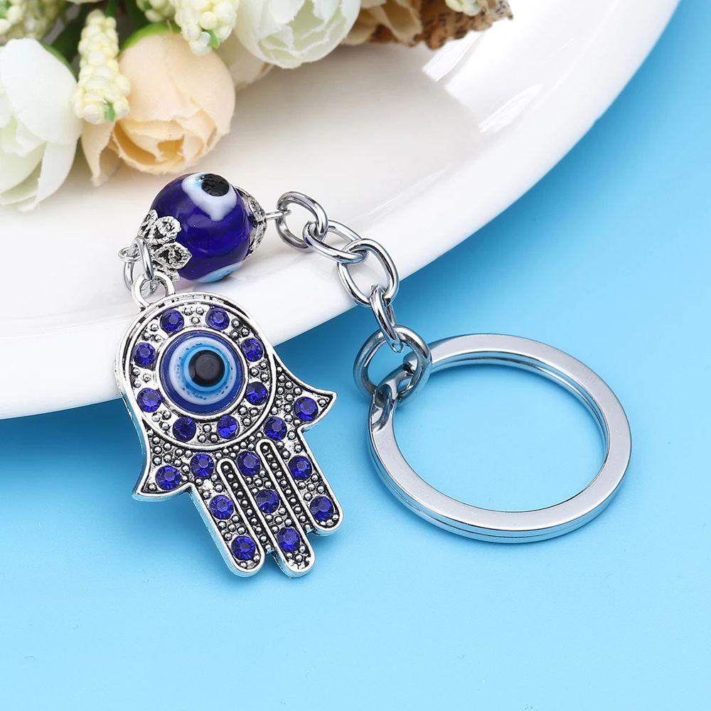 Móc khóa SKJK hình mắt quỷ màu xanh dương thời trang