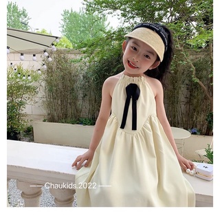 Váy kem hở lưng bé gái