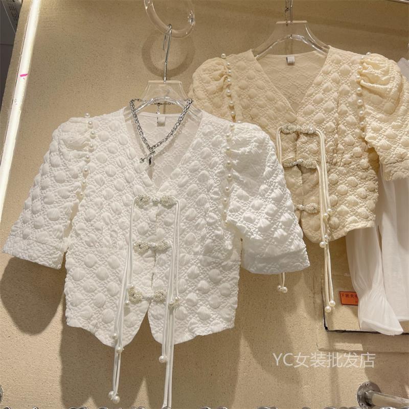 2022 summer new palace style retro design sense irregular button shirt foreign style bubble sleeve cardigan top