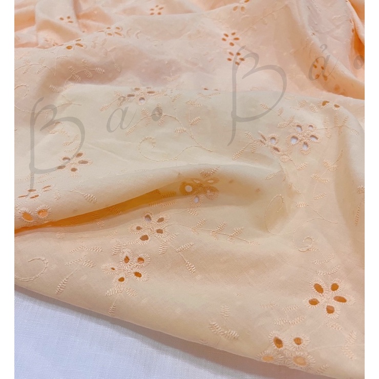 Vải Boi Cotton Thêu Hoa Đục Lỗ Cam Pastel Mềm Rũ Khổ 1m50