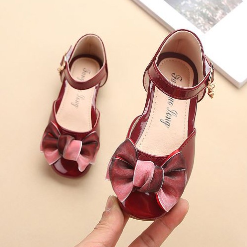 Giày búp bê nơ da bóng mềm mại màu đỏ huyết cho bé gái lớn