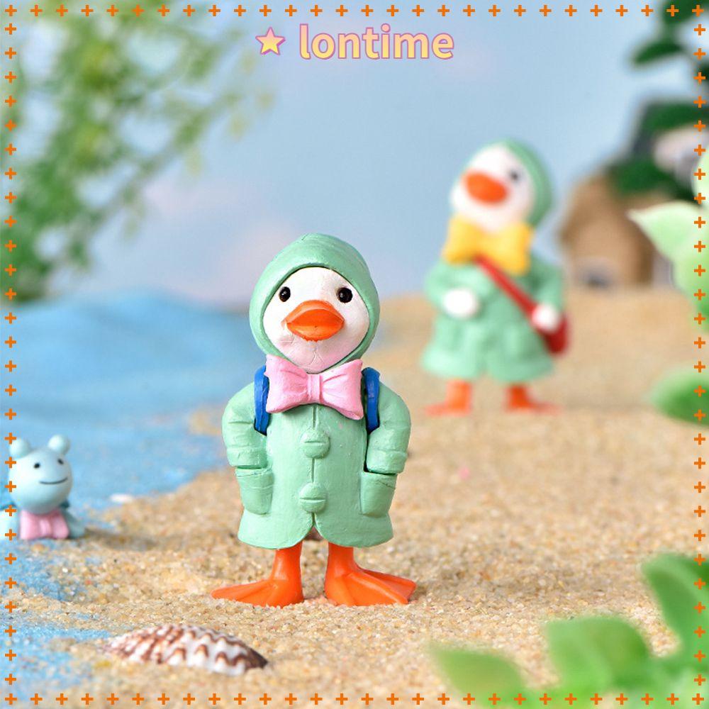 1 Đồ trang trí chú vịt mặc áo mưa dễ thương để bàn trang trí