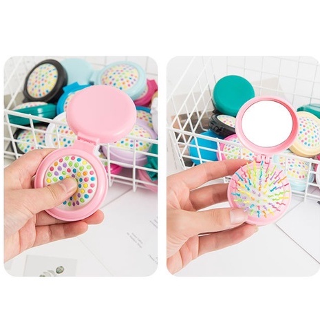 Gương mini cầm tay kèm lược massage