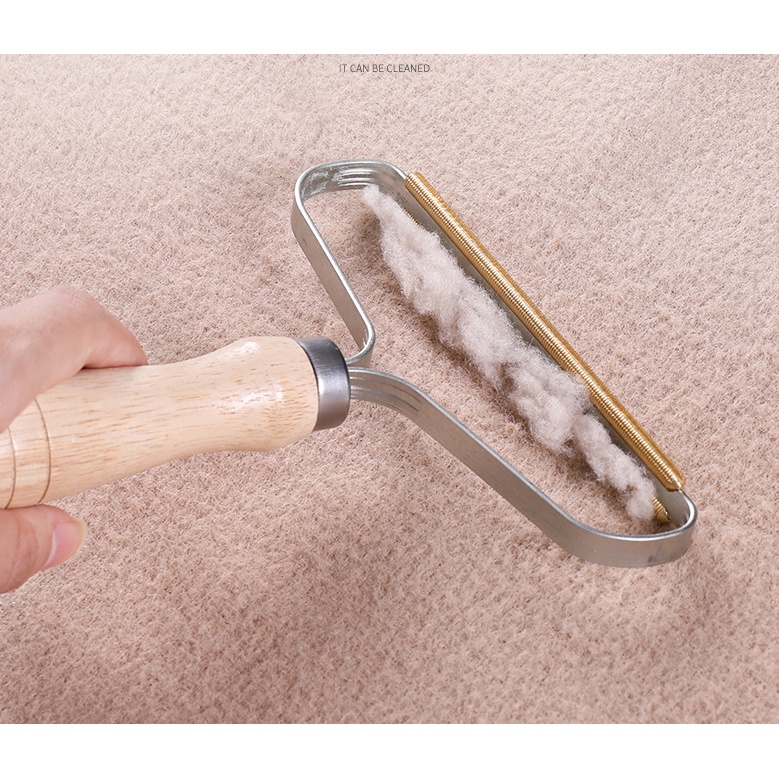 Dụng cụ loại bỏ lông xù trên quần áo tiện lợi