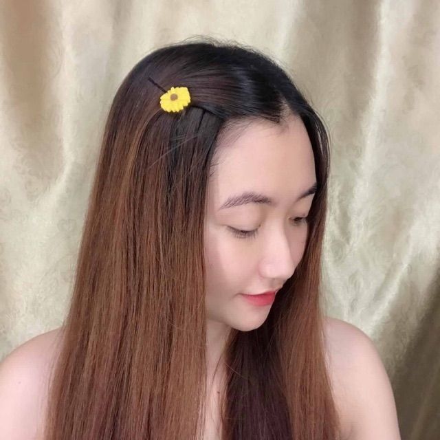 Kẹp tóc hoa cúc vàng