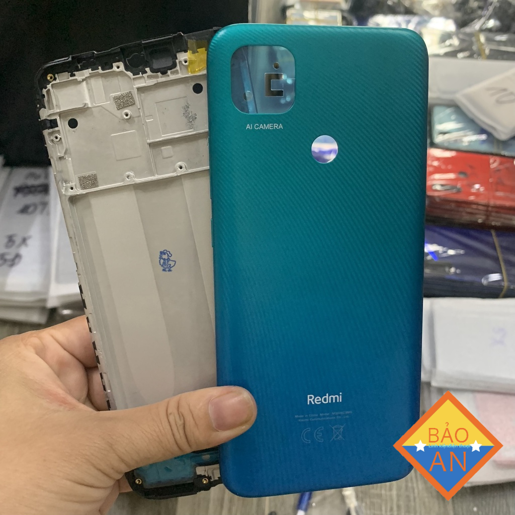 Bộ vỏ redmi 9c gồm lưng,nút tăng giảm.