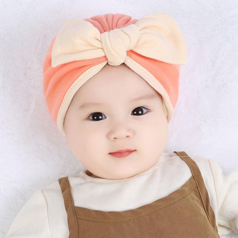 Mũ trùm đầu beanie đính nơ màu trơn đáng yêu dành cho trẻ em