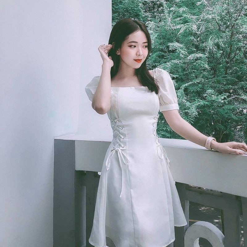 Đầm trắng tay phồng đan eo