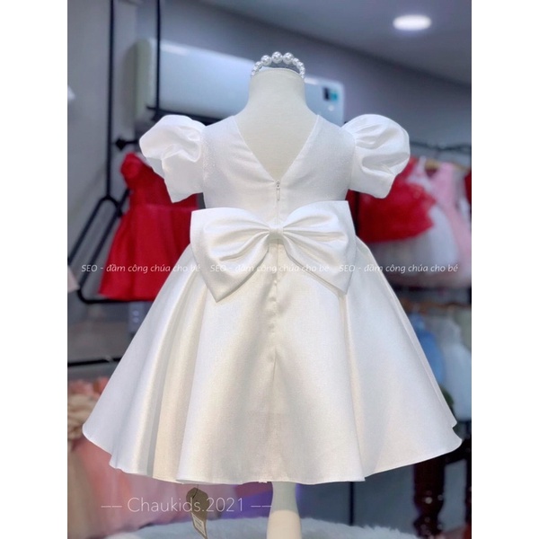 Váy ba khuy tay bồng nơ sau lưng cho bé gái