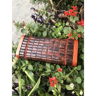 gối gỗ trắc đỏ đen .