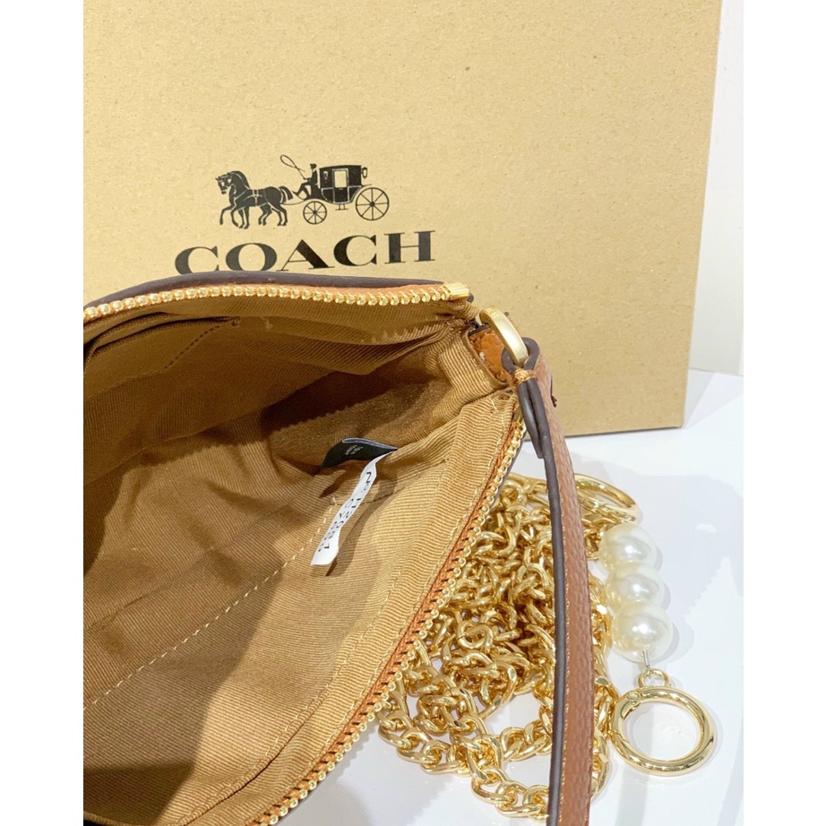 Túi kẹp nách nữ Coach thuyền full box 19cm x5cmx12cm màu trắng