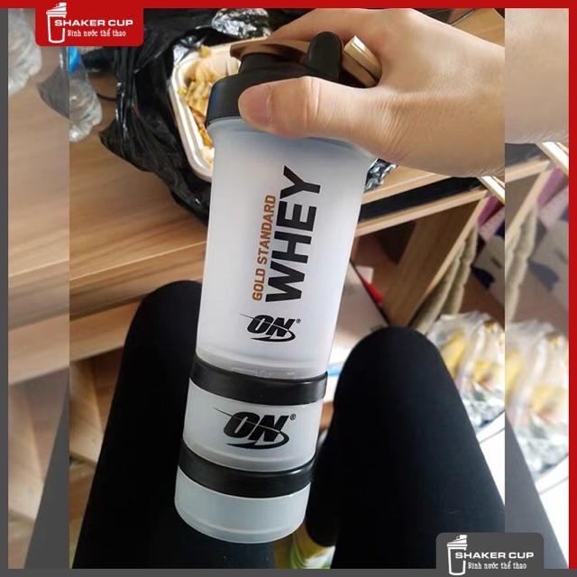 Bình lắc tập Gym bình nước Shake bottle On Gold Standard chính hãng 2 ngăn đen, 3 ngăn trắng.