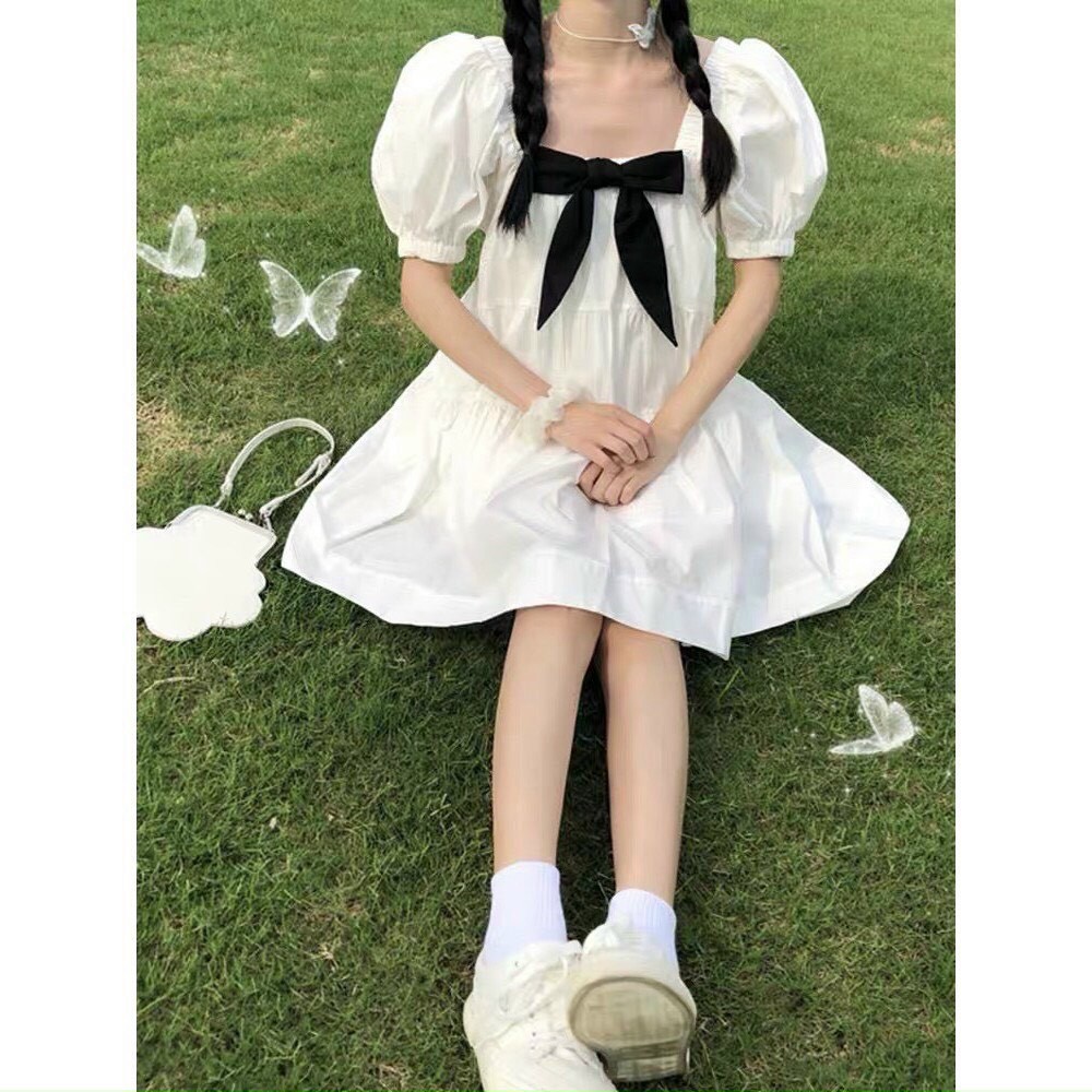 Váy đầm nữ dáng babydoll màu trắng cột nơ cổ tay bồng nữ tính