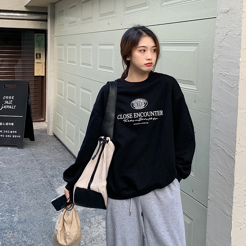 Áo thun tay dài dáng rộng in chữ phong cách Hàn Quốc thời trang cho nữ