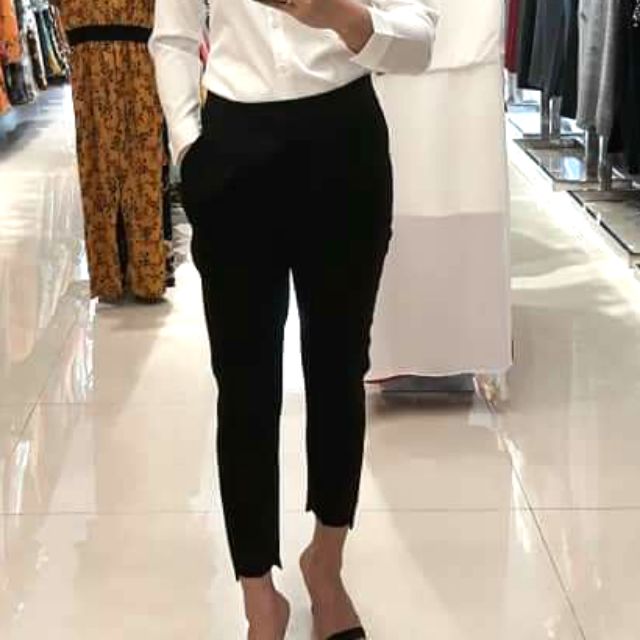 Quần tây lai lệch.tà trước ống ngắn , sau dài.