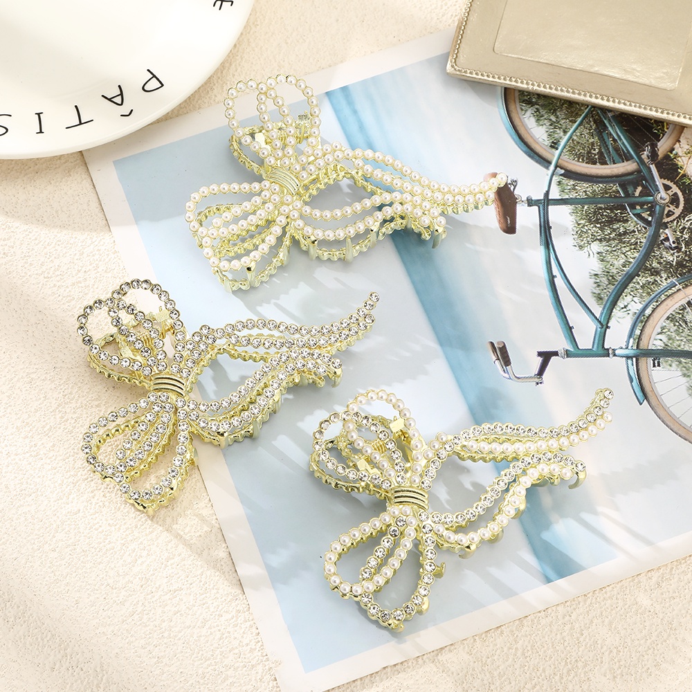 Kẹp tóc HAIMEIKANG hình chiếc nơ đính ngọc trai nhân tạo thời thượng