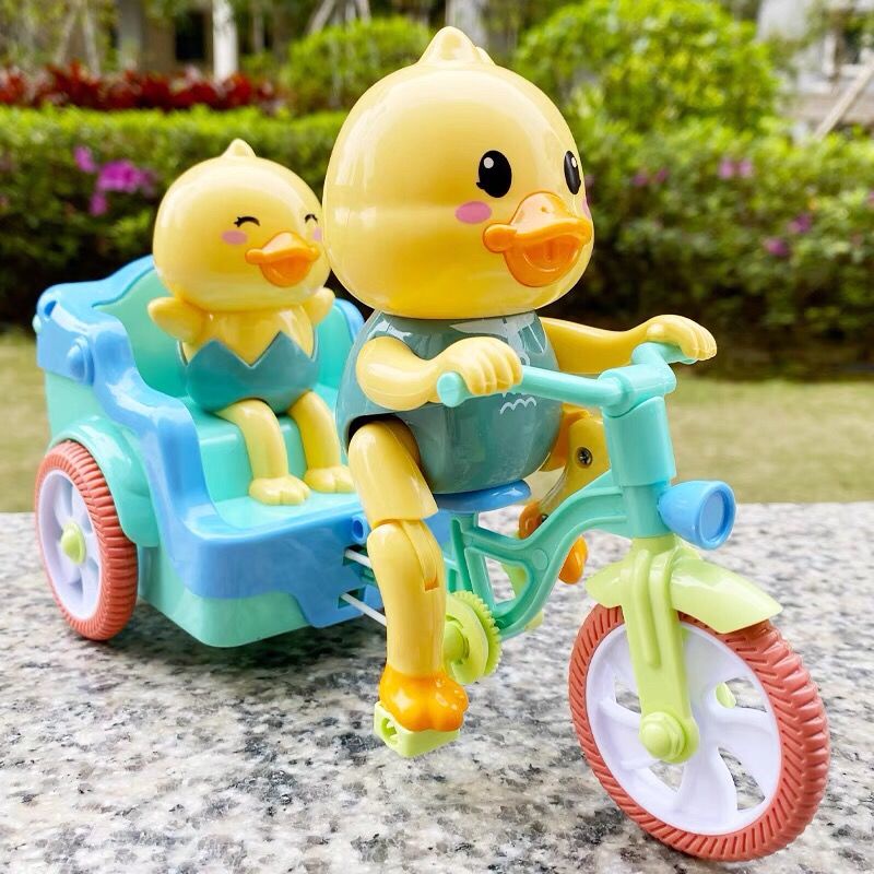xna83qctwqĐồ chơi trẻ em điện con vịt nhỏ màu vàng quay đóng thế xe ba bánh hoạt hình âm nhạc ánh sáng mạng người nổi ti