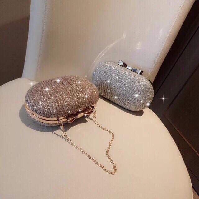 Clutch dự tiệc đính nhũ khoá nơ sang chảnh | BigBuy360 - bigbuy360.vn