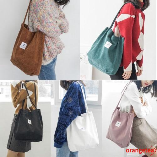 Túi đeo vai làm bằng vải canvas có nút cài nam châm