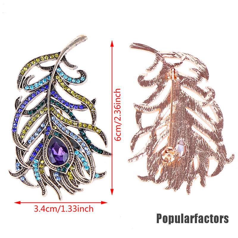 Ghim cài hình lông công đính đá thời trang