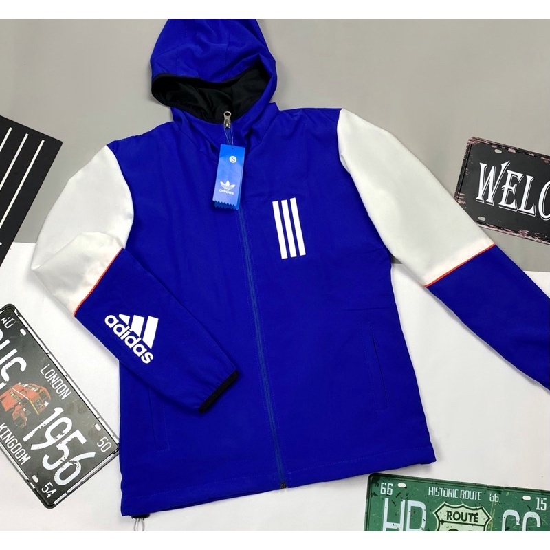 Áo Khoác Gió Nhẹ Nam Nữ 2 Lớp Có Mũ Chống Nắng Màu Xanh Trắng ADIDAS Thể Thao - Áo Khoác Dù Nam Nữ Form Xuông Có Dây Rút