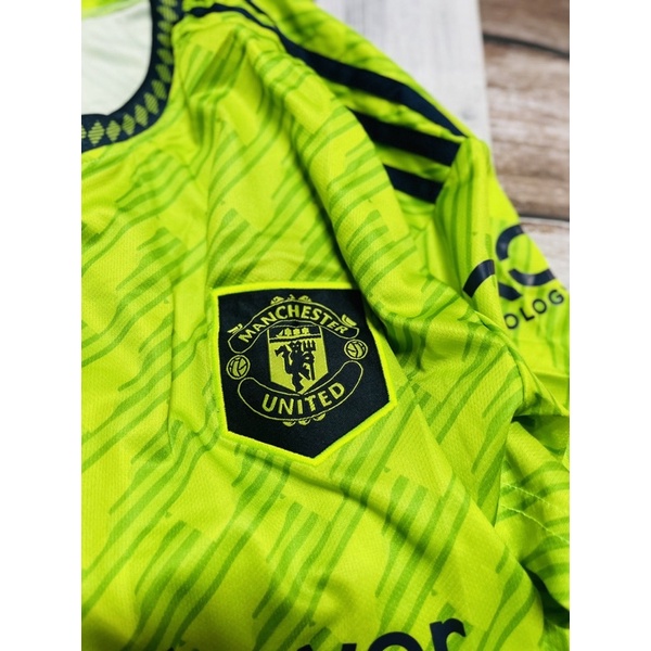 Set bộ quần áo thể thao bóng đá nam nữ vải gai mịn clb mu manchester united  áo xanh chuối quần đen logo thêu 2022 2023