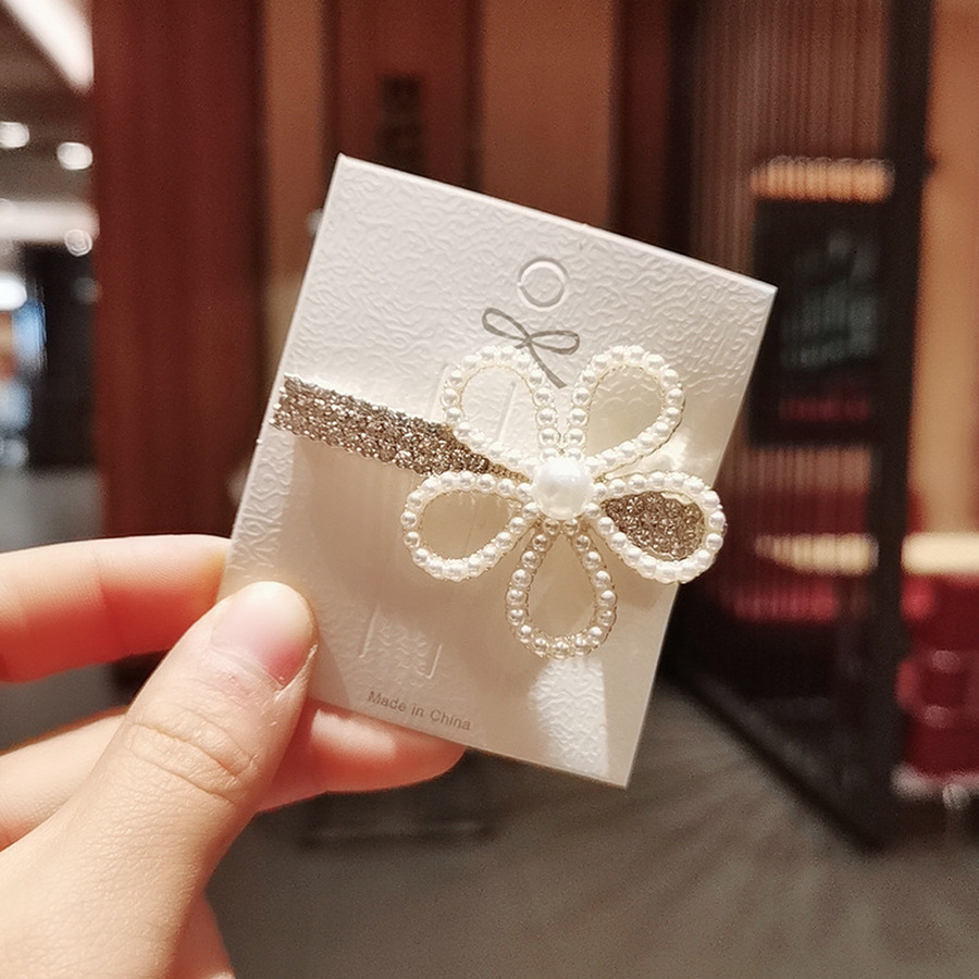 Kẹp tóc đính ngọc trai nhân tạo hình bông hoa xinh xắn cho nữ