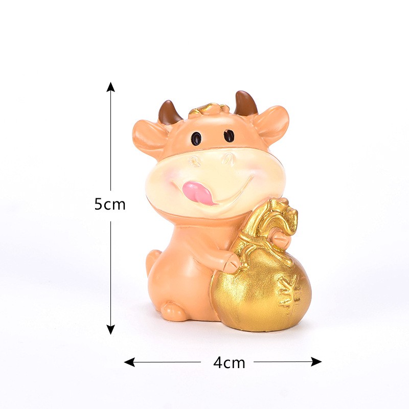 Trang trí trâu vàng cầm túi vàng