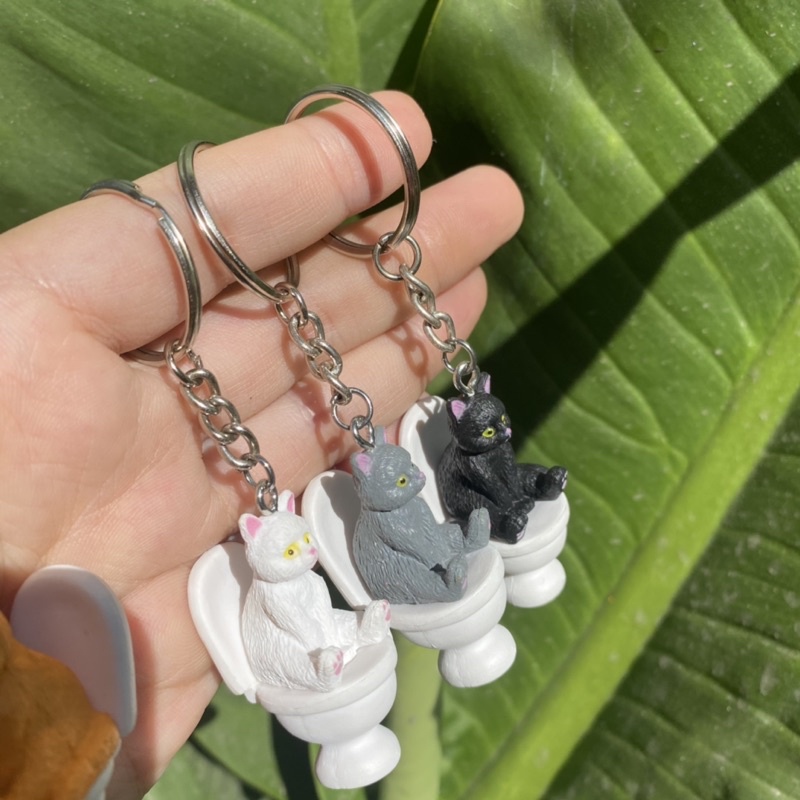 Móc khoá mèo ngồi toilet cute