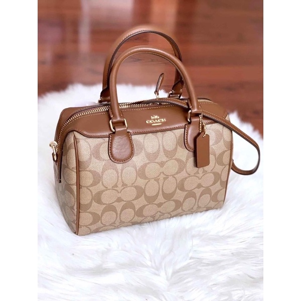 Túi C.oach trống mini logo