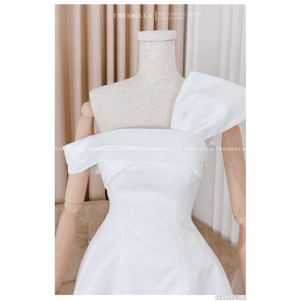 Váy thiết kế cao cấp màu trắng lệch vai phối nơ trên ngực [ Có video + Ảnh thật ] The Shilla - Aladina-50C0