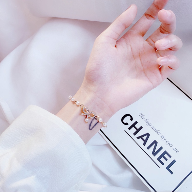 Vòng Tay Chuỗi Hạt Ngọc Trai Mặt Hình Nơ Đính Pha Lê Phong Cách Hàn Quốc Ngọt Ngào Cho Nữ