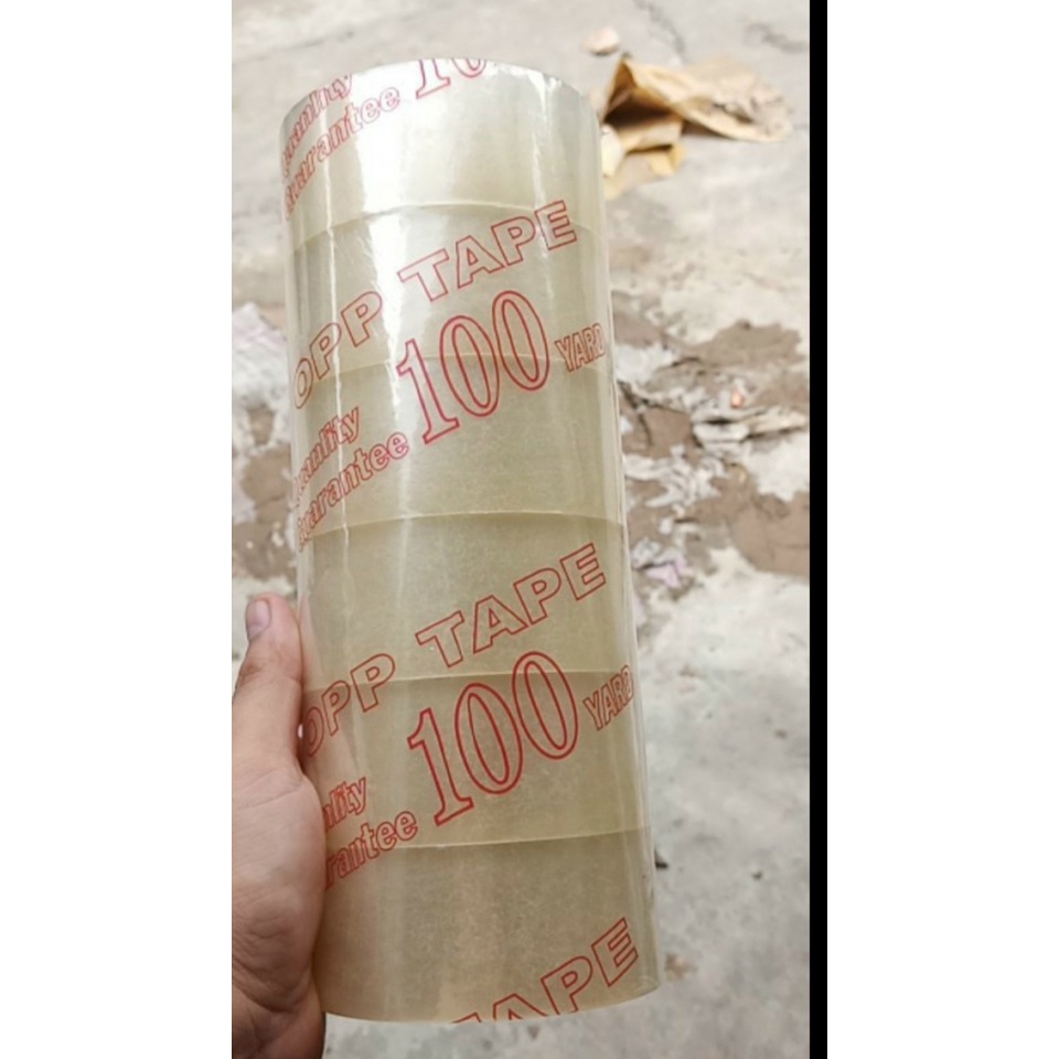 Băng keo trong đục 5cm-100y nặng 1kg 1 cây 6 cuộn màng dầy độ dính cao giao hỏa tốc trong 5 phút.!