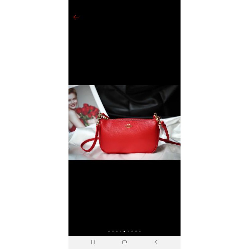 Túi cầm tay đeo chéo coach