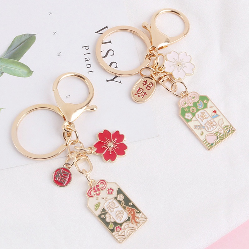 Móc khóa hình hoa anh đào cầu may mắn phong cách thời trang Nhật Bản