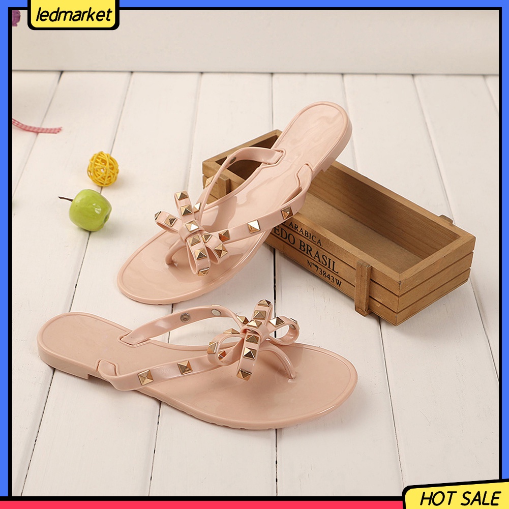 Dép đi biển phối nơ và đinh thời trang mùa hè dành cho nữ