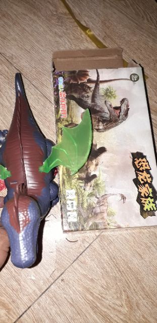 Chú khủng long chạy pin có nhạc và đèn led rất đẹp tặng kèm pin