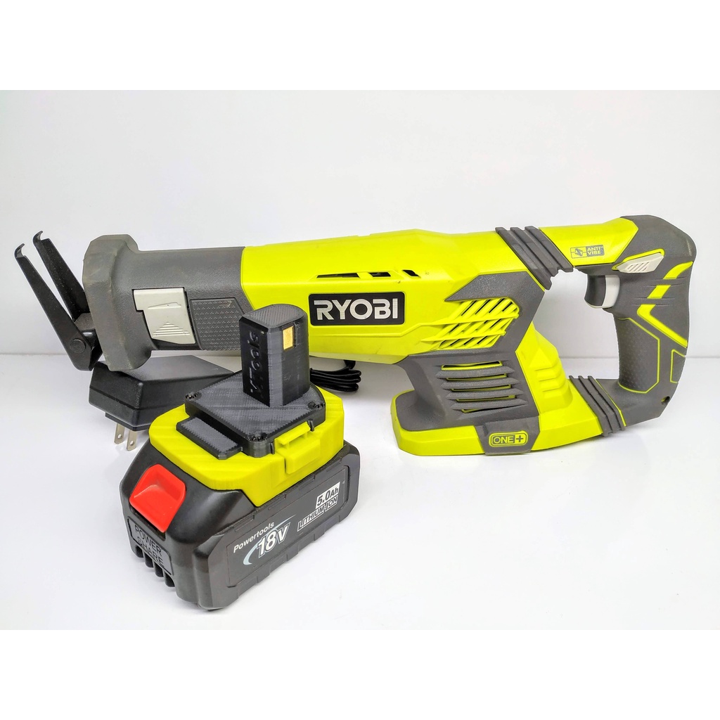 Bộ máy cưa kiem Ryobi kèm pin makita 4Ah và sạc adaptor