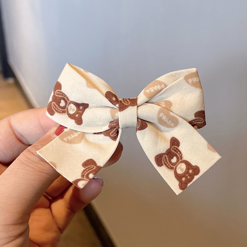 Kẹp tóc hình nơ màu đỏ sữa cà phê xinh xắn cho bé gái