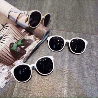 Kính râm gọng trắng mắt đen gọng tròn