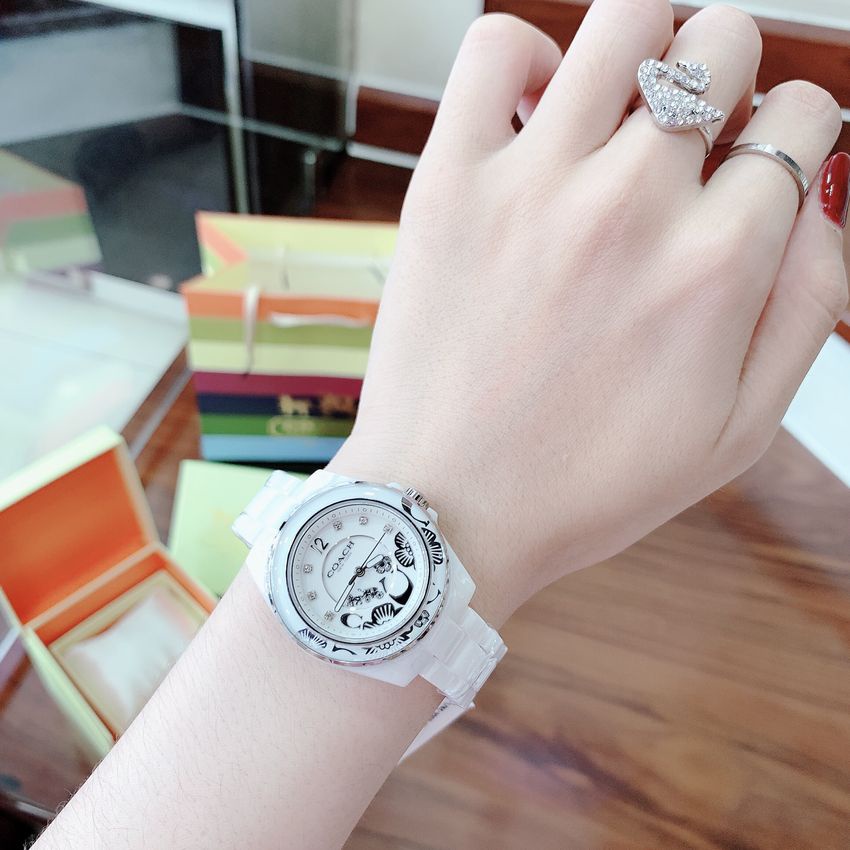 Đồng Hồ Nữ Coach Dây Đá Ceramic Trắng Nền Hoa Văn Nổi 32mm