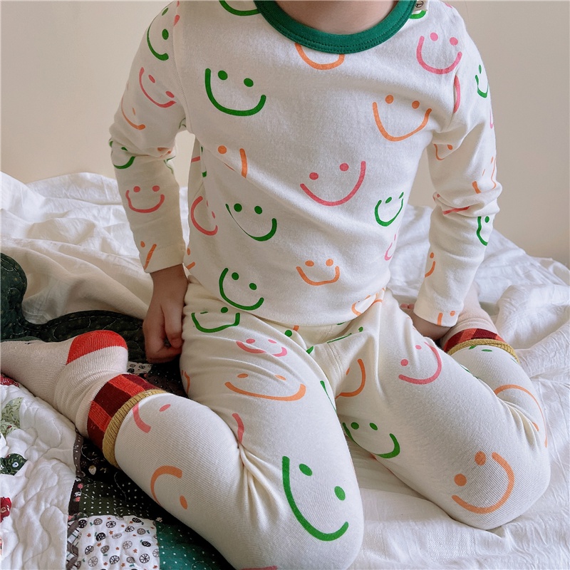 Bộ áo thun tay dài và quần dài in hình mặt cười cho trẻ sơ sinh