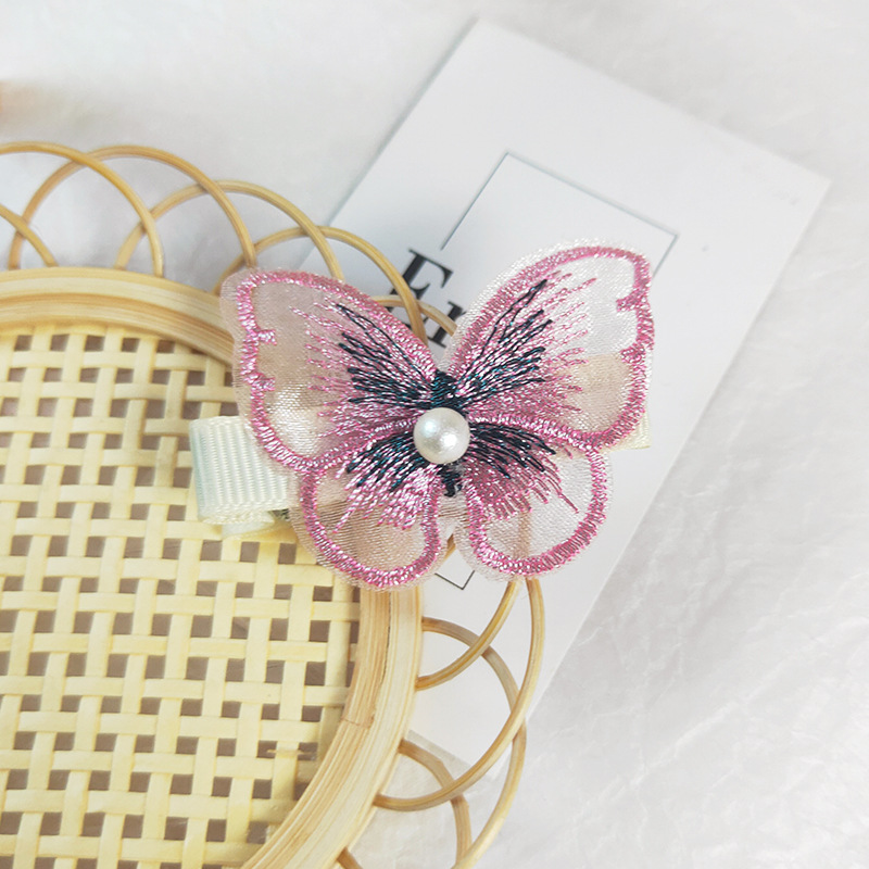 Kẹp tóc hình bướm đính hạt ngọc trai thời trang