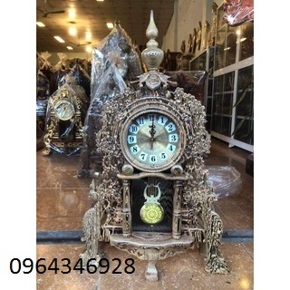 Đồng hồ gỗ mun đuôi công kích thước cao 70 cm ngang 48 cm sâu 20 cm.