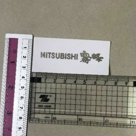 2 tem dán mặt lạnh điều hòa Mitsubishi chữ trắng