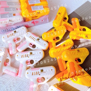 Một cái máy bắn kẹo mút (có kẹo) Hongkong Candy Gun cute cho bé